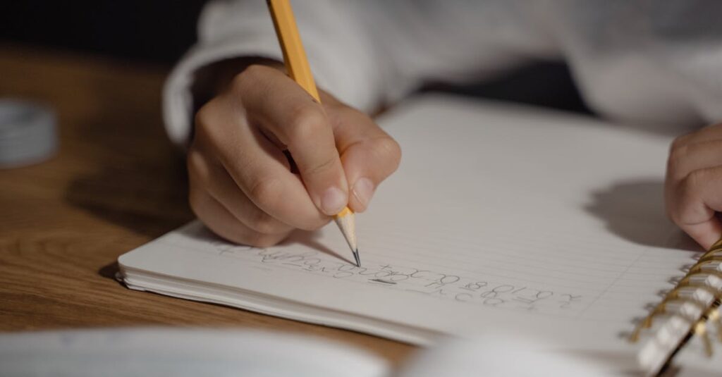 school child writing notebook