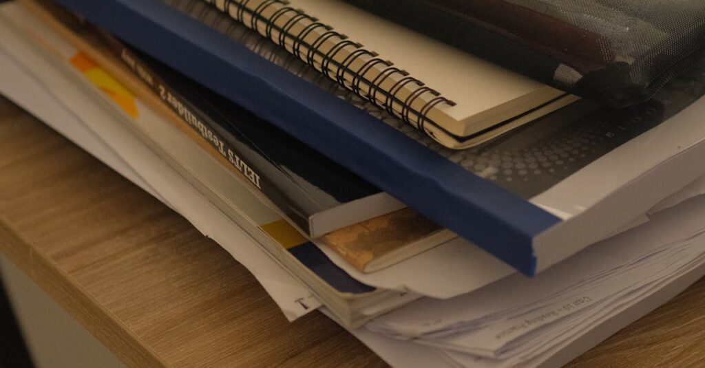 stack of notebooks desk