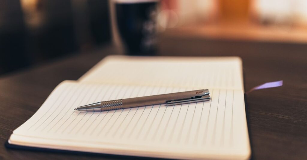 open notebook with pen