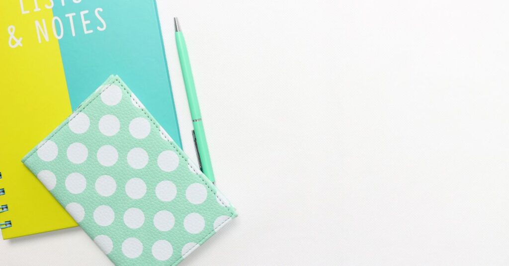 spiral notebook with pen