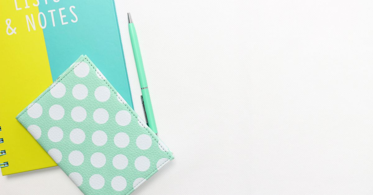 spiral notebook with pen