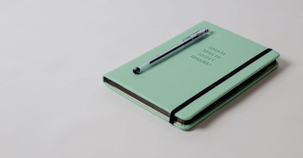 thick diary with pen