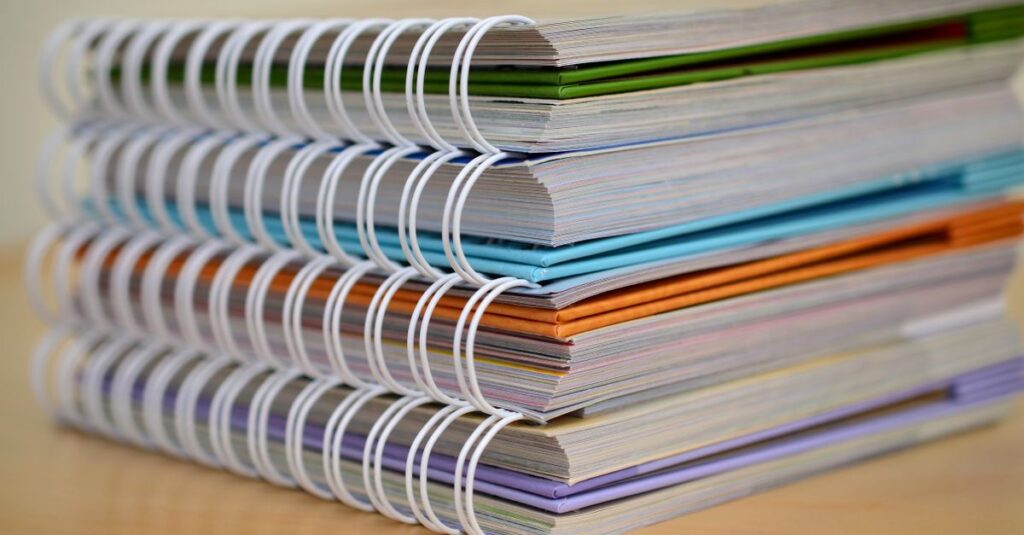 hardcover notebook stack closeup