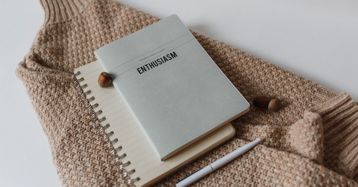 thick notebook with pen