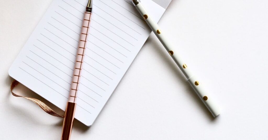 open notebook with pen