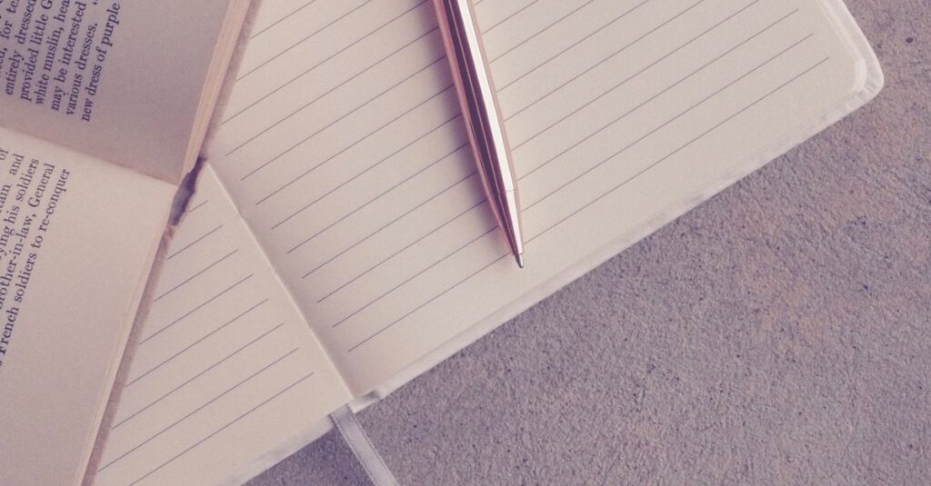 open journal with pen