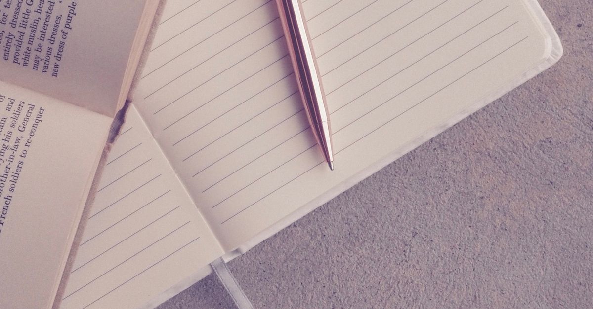 open journal with pen