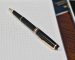 executive notebook with pen
