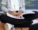 child writing in notebook