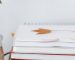 stack of notebooks on desk