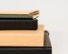 stack of long notebooks
